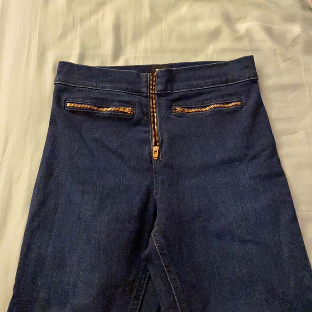 Dark wash skinny jeans with zipper detail